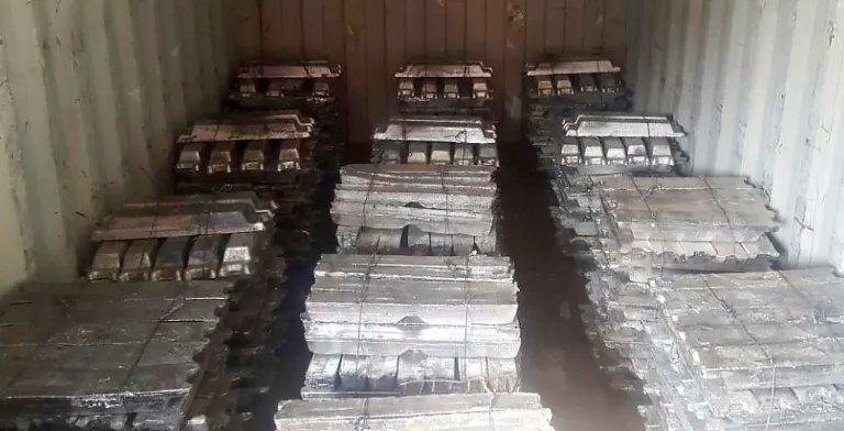 Lead ingot bundles loaded in a shipping container - Metallic Metal Trading FZCO